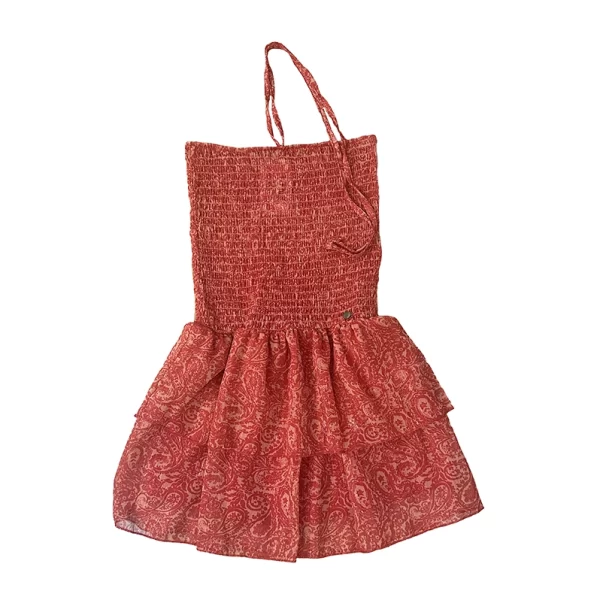 Vestido corto estampado en tonos coral y naranja con forro interior en coral. Hilos de lúrex a tono. Frunce nido de abeja en la parte superior y cinta para anudar al cuello.